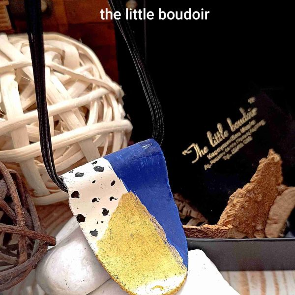 Ceramic Dalmatians and golden stone